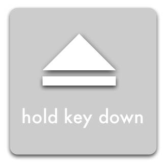 Media Eject Symbol + 'hold key down' message